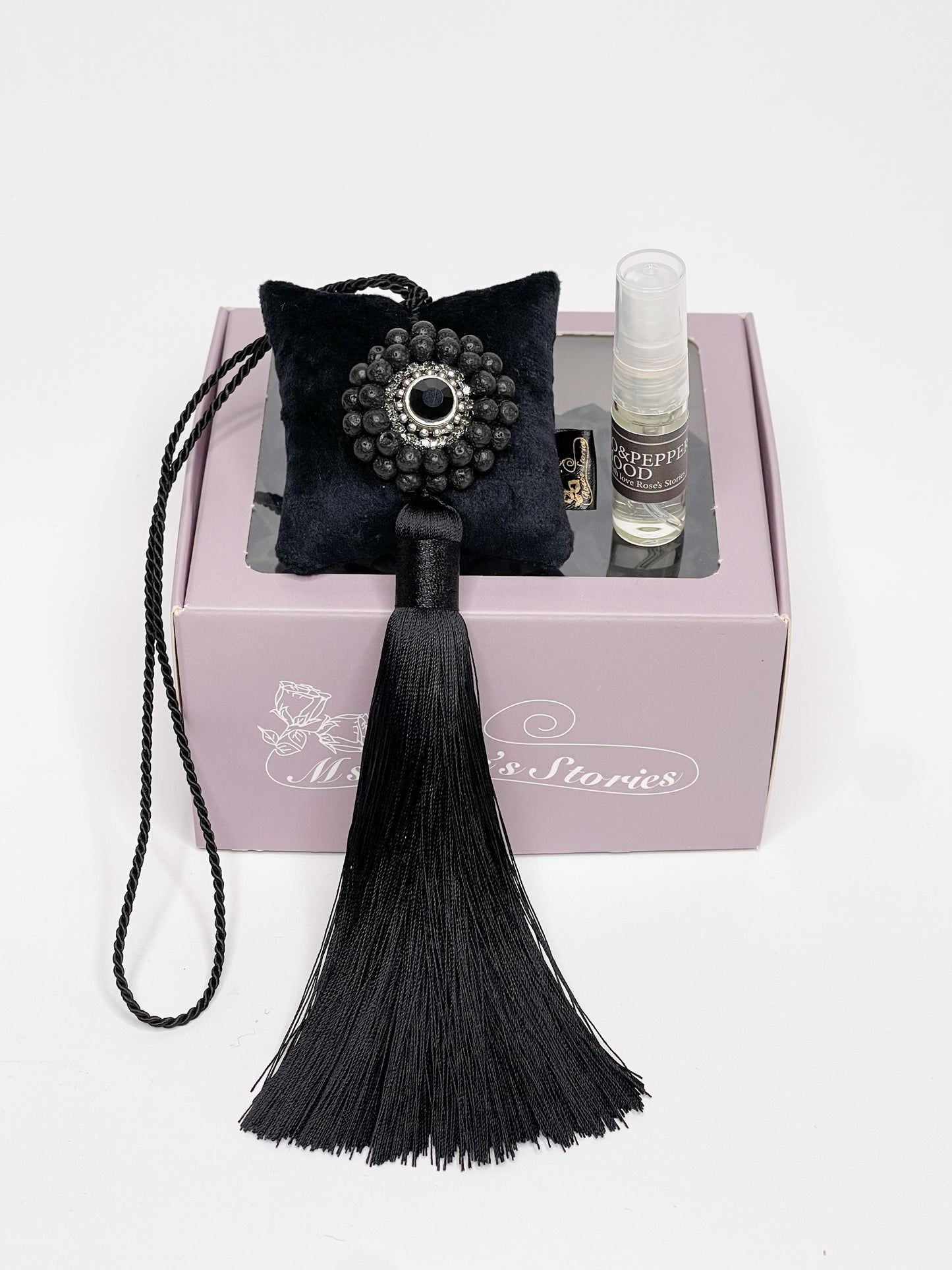 Hanging fragrance with Lava stone and long tassel.