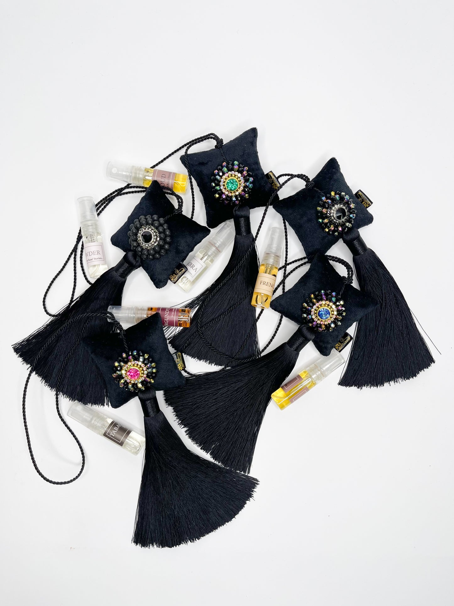 Hanging fragrance with Lava stone and long tassel.