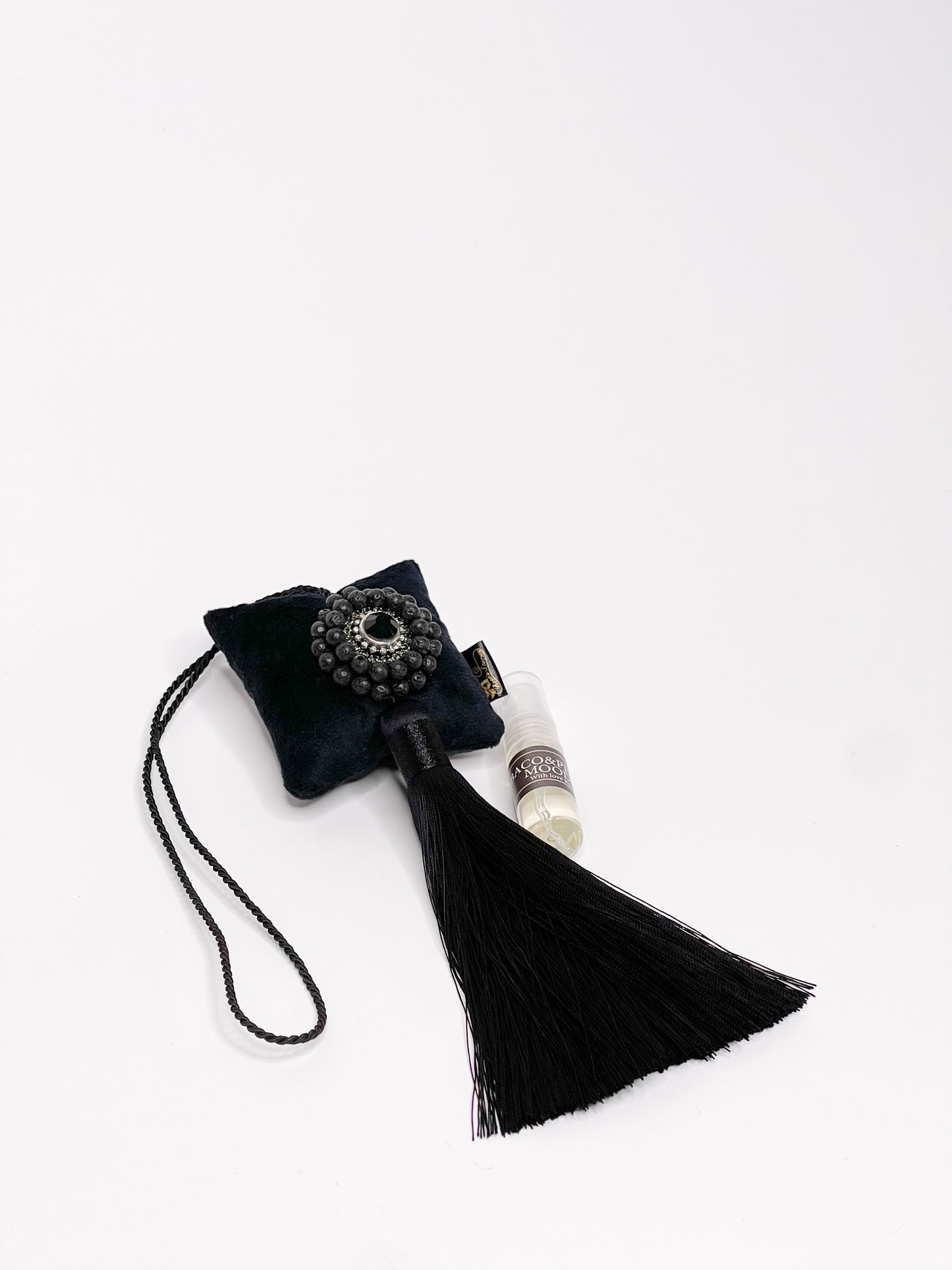 Hanging fragrance with Lava stone and long tassel.