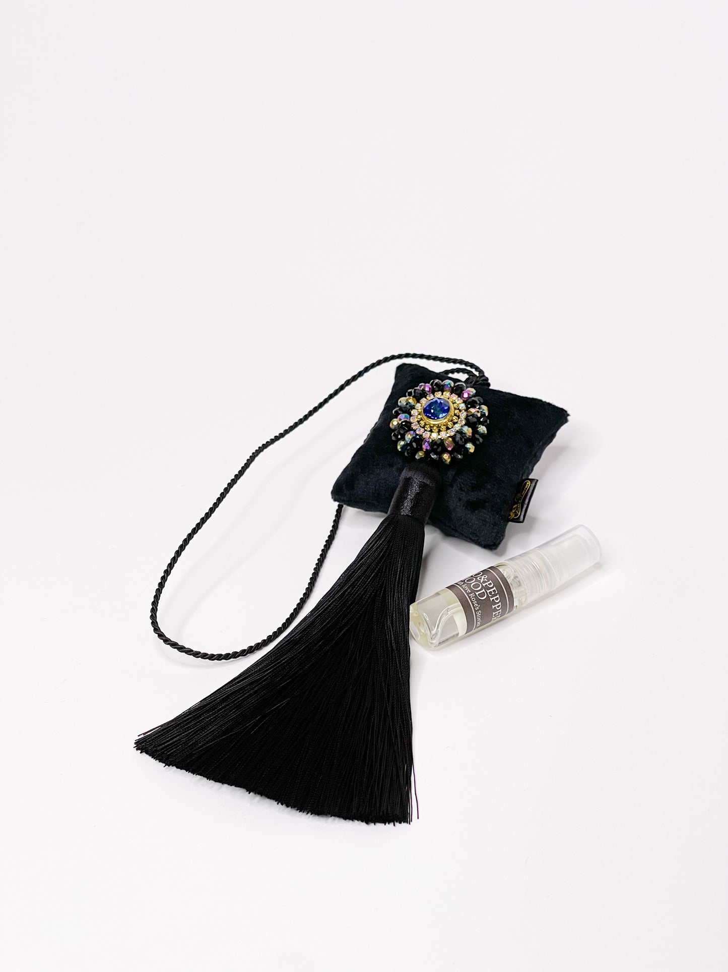 Hanging fragrance with sparkling crystals and long tassel.