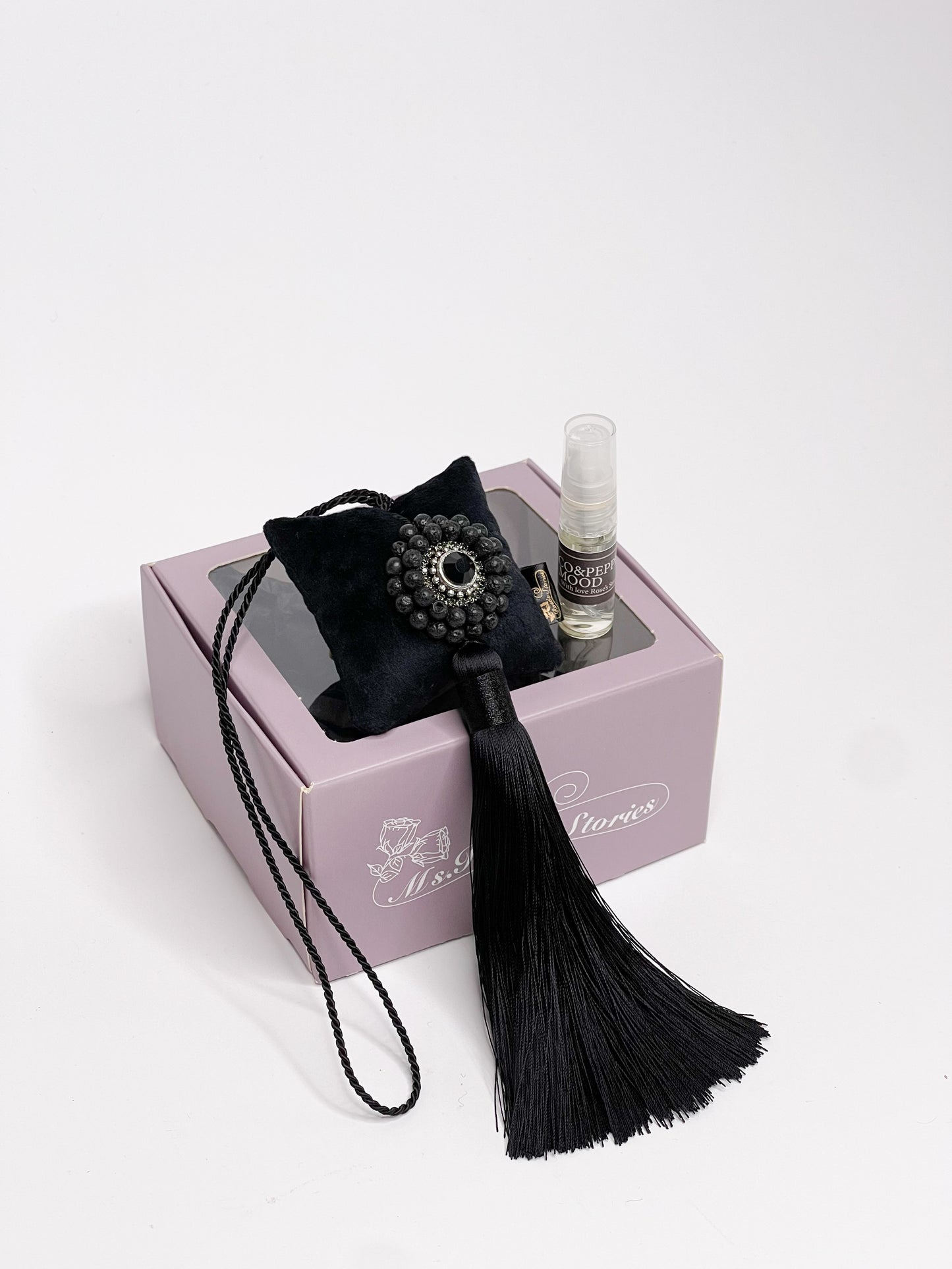 Hanging fragrance with Lava stone and long tassel.
