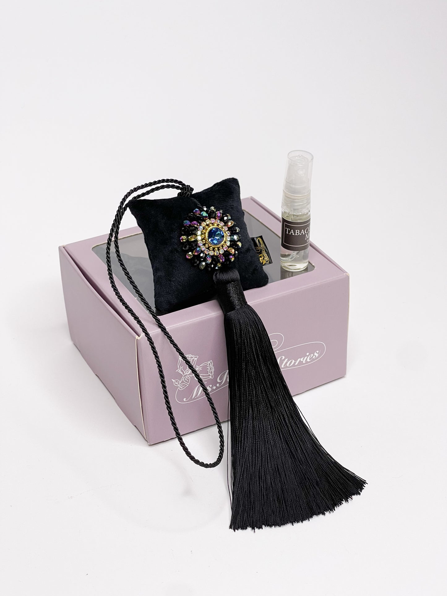 Hanging fragrance with sparkling crystals and long tassel.