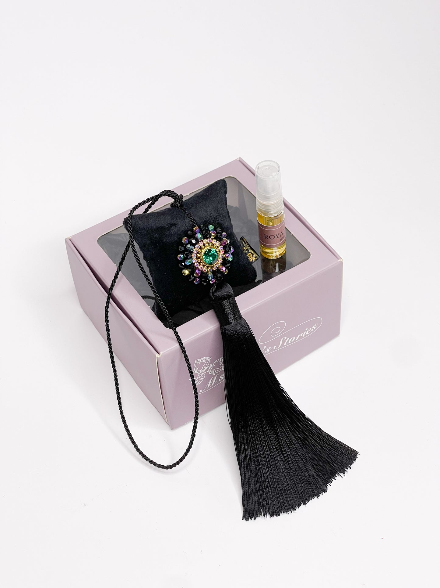 Hanging fragrance with sparkling crystals and long tassel.