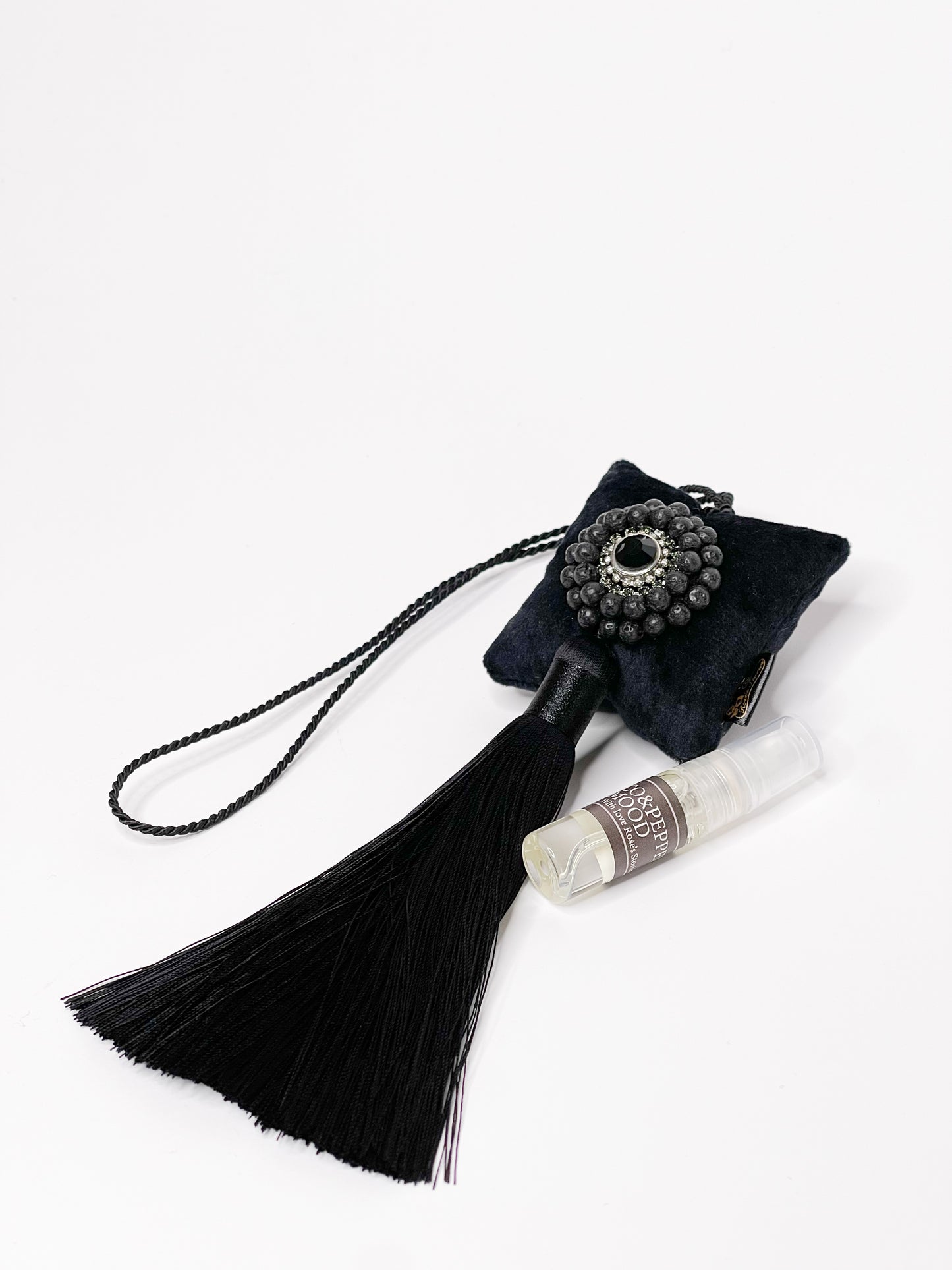 Hanging fragrance with Lava stone and long tassel.